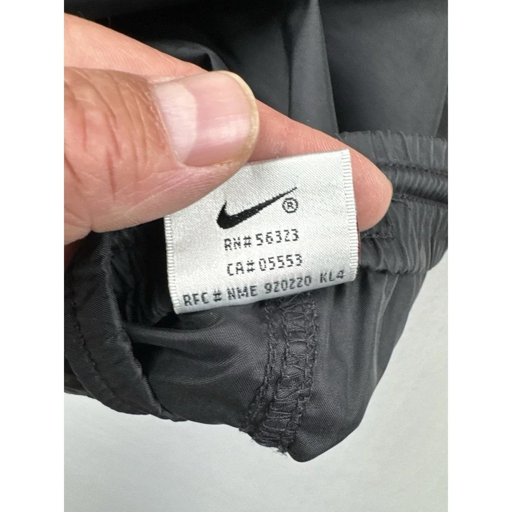 Vintage 90s Nike Black Nylon Track Pants Swoosh Zip Leg Windbreaker L